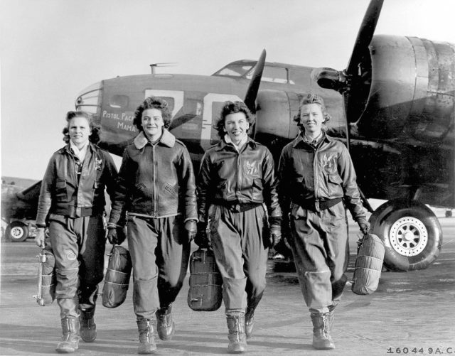 Frances Green, Margaret (Peg) Kirchner, Ann Waldner and Blanche Osborn leaving their plane, “Pistol Packin’ Mama,” at the four-engine school at Lockbourne AAF, Ohio, during WASP ferry training B-17 Flying Fortress.
