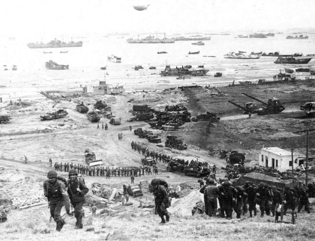 The build-up of Omaha Beach: reinforcements of men and equipment moving inland.