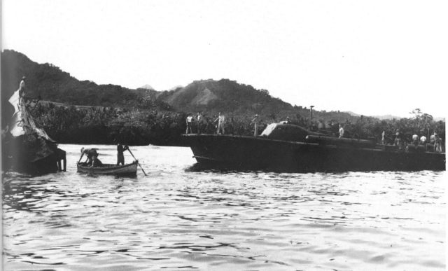 The crew of US PT boat PT 59 inspects the wreckage of the Japanese submarine I-1, sunk on 29 January 1943 at Kamimbo on Guadalcanal by HMNZS Kiwi and Moa.