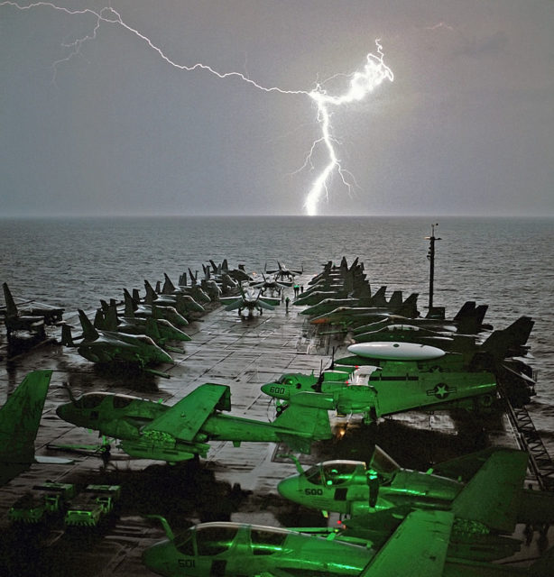 Lightning strikes in the horizon as Abraham Lincoln sails in the Arabian Sea.