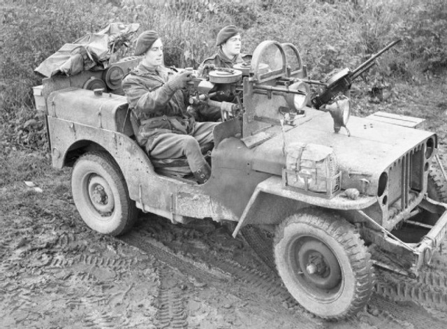 Operation Clipper. A jeep manned by Sergeant A Schofield and Trooper O Jeavons of 1 SAS near Geilenkirchen in Germany. The jeep is armed with three Vickers ‘K’ guns, and fitted with armoured glass shields in place of a windscreen. The SAS were involved at this time in clearing snipers in the 43rd Wessex Division area.