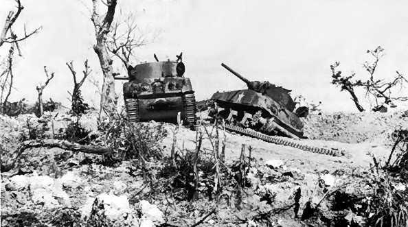 Two U.S. M4 Sherman tanks knocked out by Japanese artillery at Bloody Ridge, 20 April 1945.