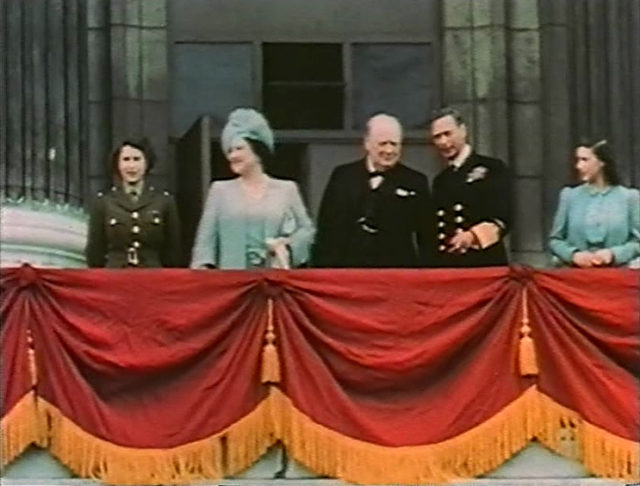 Princess Elizabeth (left, in uniform) on the balcony of Buckingham Palace with (left to right) her mother Queen Elizabeth, Winston Churchill, King George VI, and Princess Margaret, May 8, 1945.