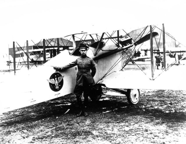 Billy Mitchell posing with his Vought VE-7 Bluebird aircraft at the Bolling Field Air Tournament (in Washington, D.C.), held on May 14–16, 1920.