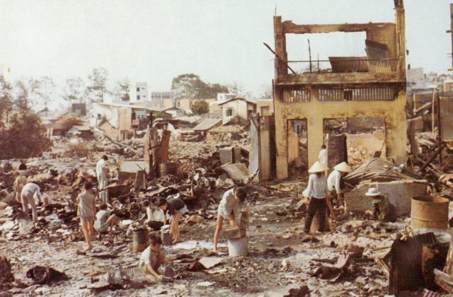 Civilians sort through the ruins of their homes in Cholon, the heavily damaged Chinese section of Saigon.