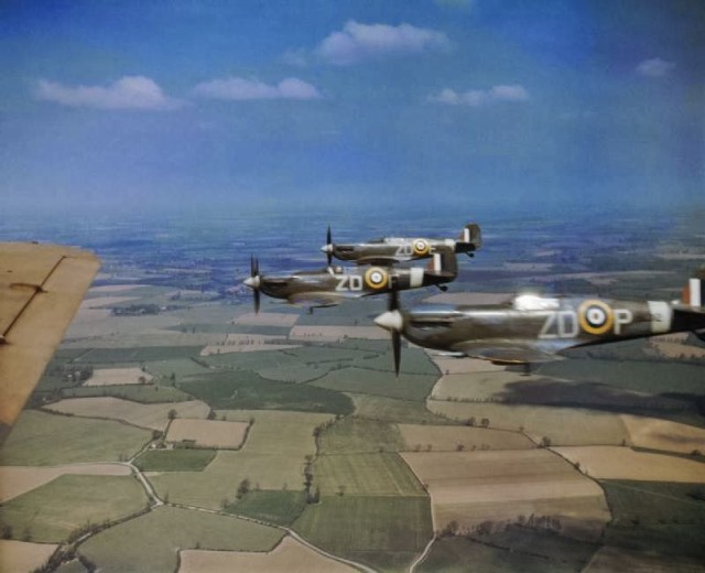 Three Spitfires flying in formation over Essex, 1939-1945. © IWM (COL 190)
