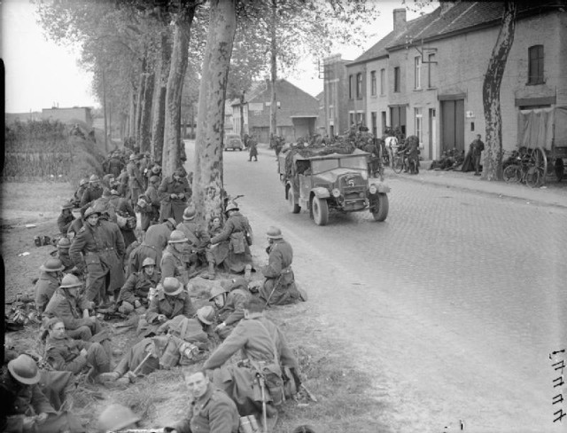 Belgian soldiers resting at the roadside. By Malindine E G (Lt), War Office official photographer - http://media.iwm.org.uk/iwm/mediaLib//47/media-47906/large.jpgThis is photograph F 4444 from the collections of the Imperial War Museums., Public Domain