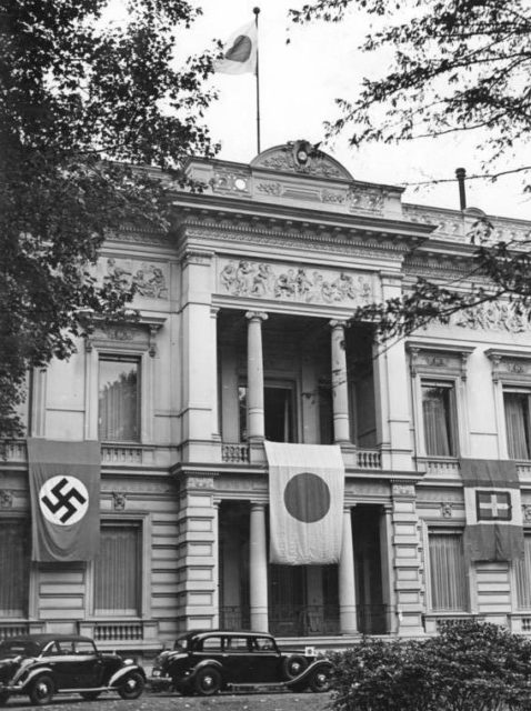 Flags of Germany, Japan, and Italy draping the facade of the Embassy of Japan on the Tiergartenstraße (Zoo Street) in Berlin (September 1940). Photo Credit.