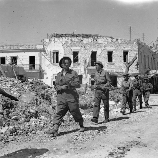 The British Army in Tunisia 1943 British troops advance warily through Bizerta, 8 May 1943.