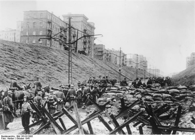 German soldiers passing by Soviet barricades on street in Charkov. October 1941.