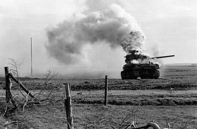 A Sherman burns in Germany. Common fate for many Allied armour.