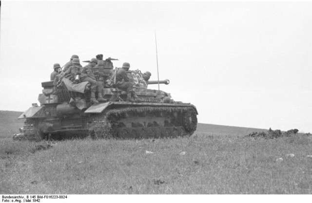 German soldiers on PzKpfw IV during campaign on Crimea. May 1942