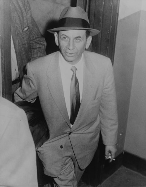 Meyer Lansky at 54 St. police station, New York City, being booked for vagrancy.