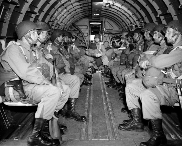 Airborne troops prepare for the descent on Europe of D-Day invasion June 6, 1944. View from interior of a glider (Image).