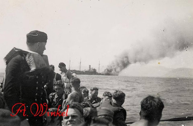 German survivors watch the Marburg, while the ship is seen drifting towards the shores of Ithaki. Source: A. Winkel)