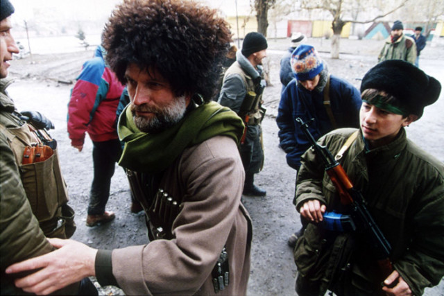 A group of the Chechen boyeviki (fighters). By Photo: Mikhail Evstafiev, CC BY-SA 3.0.