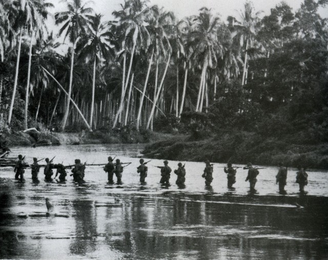 A U.S. Marine patrol crosses the Matanikau River in September 1942.