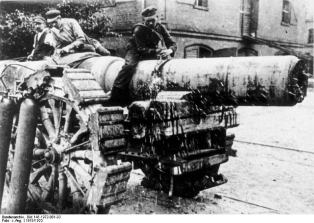 Workmen decommission a heavy gun, to comply with the treaty. Photo Credit.