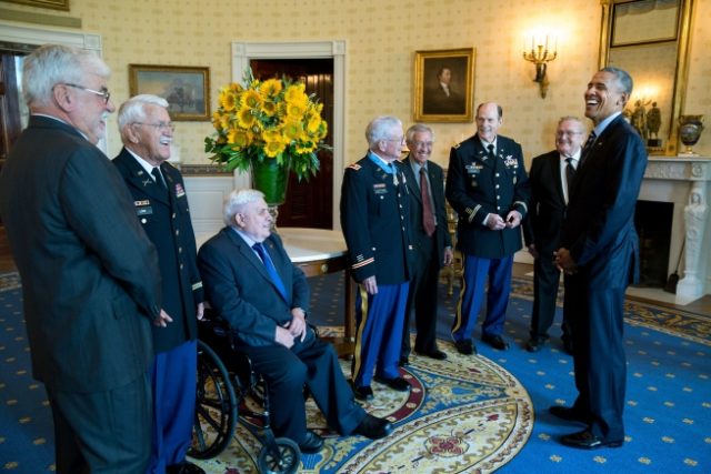 Obama talks with Kettles (center) and his guests, former brothers-in-arms from Vietnam, following the Medal of Honor ceremony for Kettles at the White House, July 18, 2016.