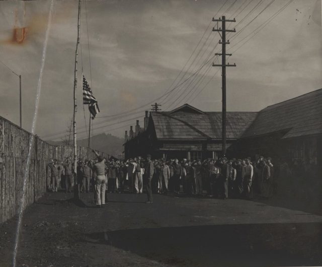 Flag raised after liberation at the Hakodate Branch Camp No. 3 on Hokkaido. From the Alex Martin Collection (COLL/5234) at the Marine Corps Archives and Special Collections.