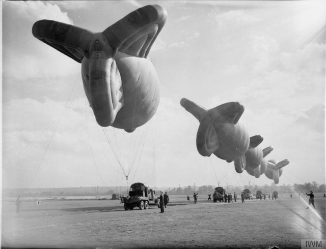 Kite balloons and balloon winches of No. 1 Balloon Training Unit are prepared for handling practice at Cardington, Bedfordshire. [© IWM (CH 1521)]