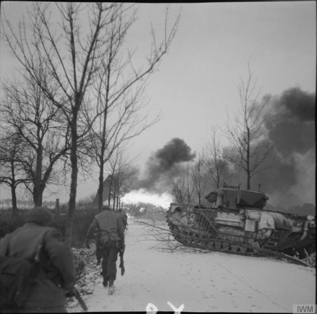 Churchill Crocodile flamethrowers in action against the village of St Joost, north of Schilberg, during an attack by 1st Rifle Brigade, 20 January 1945 [© IWM (B 13944)].