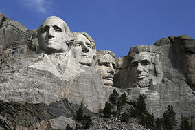 Mount Rushmore's Presidents from left to right, George Washington, Thomas Jefferson, Theodore Roosevelt and Abraham Lincoln. Photo via Dean Franklin and Wikipedia. 