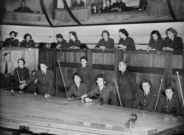 WAAF plotters at work in the Operations Room at Headquarters, No 11 Group, Uxbridge, Middlesex. [© IWM (CH 7698)]