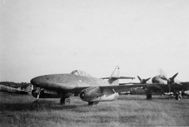 Captured by the British at the airport in Lübeck German jet fighter Messerschmitt Me-262. In the background, on the right - a German night fighter Junkers Ju-88 (Ju.88G). 