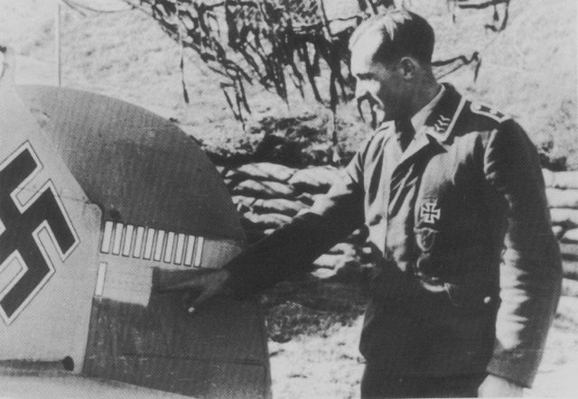 Sergeant Schnell Siegfried of the 4.JG2 Squadron presents a marks of victories on the tail of his Messerschmitt fighter Bf 109E. [Via]
