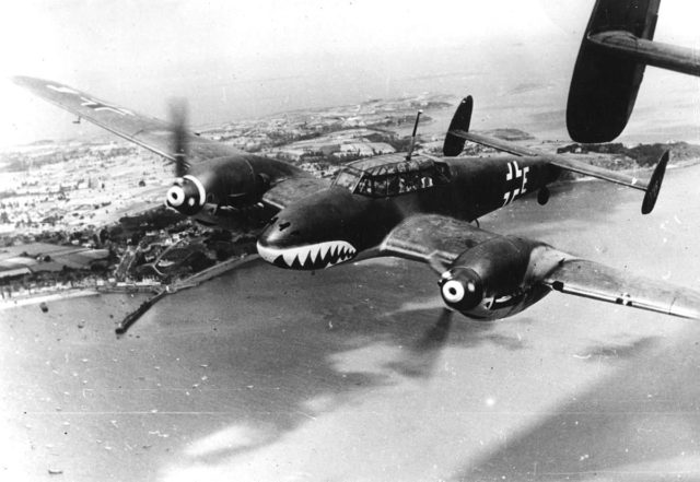 Messerschmitt Bf110 fighter of Zerstörergeschwader 76 heavy fighter squadron over the English Channel, Aug 1940. These were the first fighters with the shark’s mouth that inspired the RAF in Africa and the AVG in China. [Public Domain]