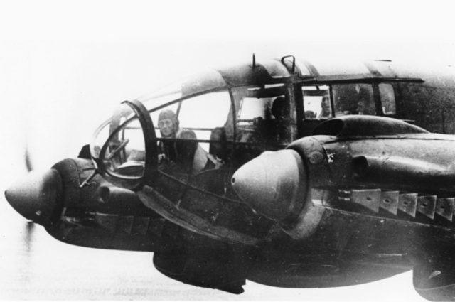 The front of a Heinkel He-111 medium bomber in flight during a bombing mission to London, England, United Kingdom. November 1940. [Public Domain]