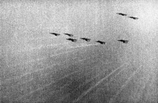 A still from camera-gun film taken from a Supermarine Spitfire Mark I of No. 609 Squadron RAF, flown by Flying Officer Tadeusz "Novi" Nowierski (formerly Polish Air Force) as he closes in on a formation of Dornier Do 17Zs of KG3 south-west of London at approximately 5.45 pm on 7 September 1940, the first day of the Blitz. Tracer bullets from the intercepting Spitfires can be seen travelling towards the enemy aircraft which were heading back to their base after bombing East London and the docks. [© IWM (CH 1820)]