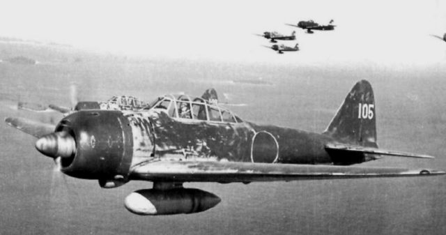 Hiroyoshi Nishizawa in his Mitsubishi Zero A6M3 Model 22 (tail code UI-105) from the 251st Kōkūtai over the Solomon Islands in May 1943. The unit's aircraft have been hastily sprayed with dark green camouflage paint on the upper surfaces.
