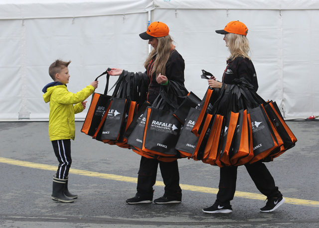 Free bags and a hostesses. (Photo by Fyodor Borisov/Transport-Photo Images)
