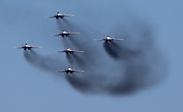 The Russian Airforce aerobatic group 'Swifts' at MiG-29 at Aviadarts military exercise at Dubrovichi Air Range. (Photo by Fyodor Borisov/Transport-Photo Images)