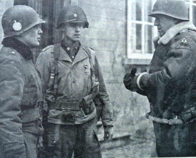 The photo above shows Lt. Gen, George S. Patton Jr., (right) chats with Brig. Gen. Anthony C. McAuliffe and Lt. Col. Steve Chappuis (center), after awarding them both the US Army Distinguished Service Cross for their defense of Bastogne. Note the front entry of the Chateau Rolle in the backdrop with that typical white window frame, as still exists. According to the book, General Patton was very pleased to come over to the chateau and saw the charred remains of the German Tanks that were knocked out by the 101st Airborne Division during the attack on this US Army Command Post on Christmas Day 1944. (photo taken by Capt. Joseph Pangerl, December 30, 1944).