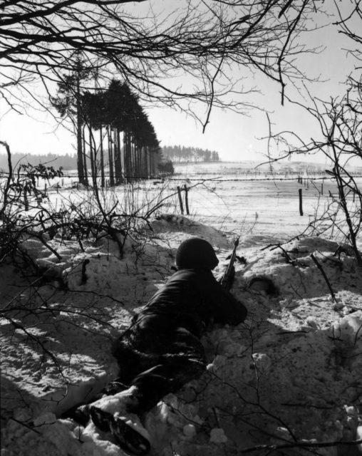 The photo above depicts a typical winter scene in the Ardennes near Bastogne. Open fields, dense pine forests, cattle fences and ditches. It was not easy to dig foxholes in the frozen ground during the very harsh winter of 1944/45.