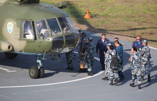 Group of China Airforce servants are boarding to the Mil Mi-8 Russian Airforce military helicopter at Aviadarts military exercise at Dubrovichi Air Range. (Photo by Fyodor Borisov/Transport-Photo Images)