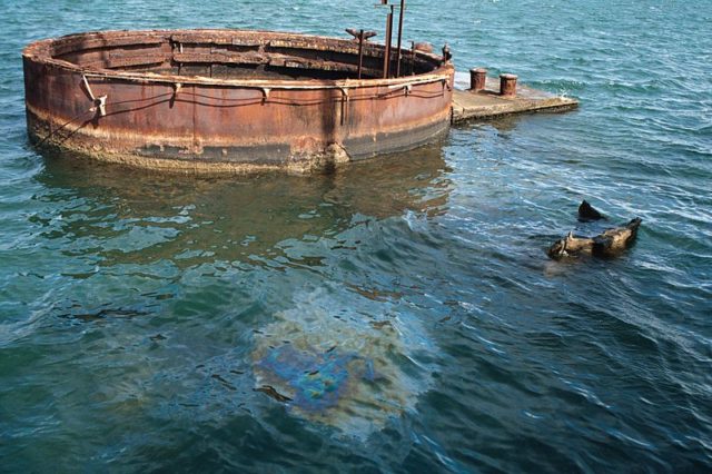 The "tears of the Arizona". Oil slick visible on water's surface above the sunken battleship. © by James G. Howes, November, 2005