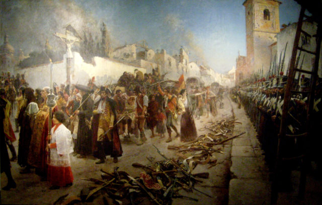 The final defeat of the Spanish troops. As part of the surrender agreement, the spanish garrison was forced to drop their weapons outside of the city walls, then offered a choice of joining Napoleon or rotting in prison. Most chose prison. Source: wiki/public domain.
