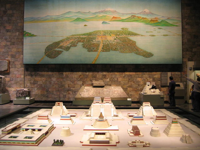Model of the temple complex showing an image of the floating city and its causeways. Photo Credit.