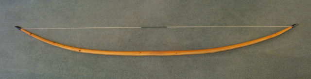 Self-yew English longbow, 6 ft 6 in (1.98 m) long, 470 N (105 lbf) draw force. Photo Credit.