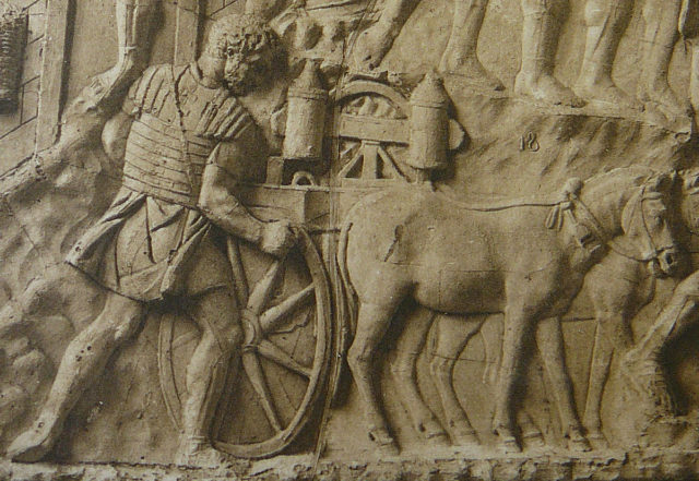 A legionary transports artillery to war, as shown on Trajan's Column - public domain.