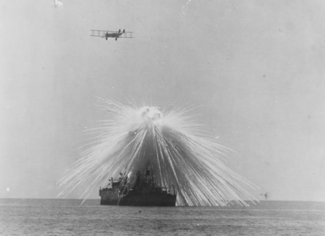 Air burst of a white phosphorus bomb over the USS Alabama during a test exercise conducted by General Billy Mitchell, September 1921.