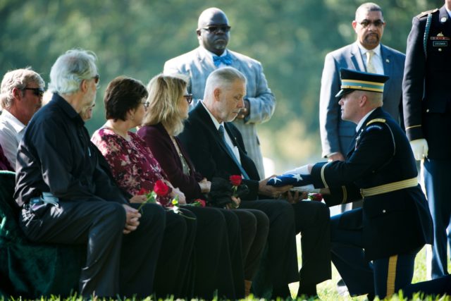 Donald Beals receives the American flag during the graveside service for his uncle U.S. Air Force 1st Lt. Donald Beals in Arlington National Cemetery, Oct. 17, 2016, in Arlington, Va. 1st Lt. Beals died when his single-seat P-47D “Thunderbolt” was struck by intense anti-aircraft fire above Lonnewitz, Germany on April 17, 1945. His remains were recently recovered and identified. (U.S. Army photo by Rachel Larue/Arlington National Cemetery/released)