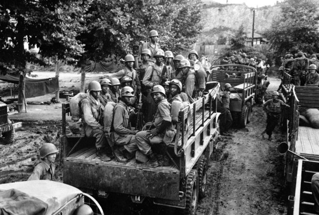 Troops of the 24th Infantry move to the Masan battleground 