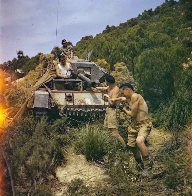 Cleaning the barrel of the 6-pdr in Tunisia; Photo Source 