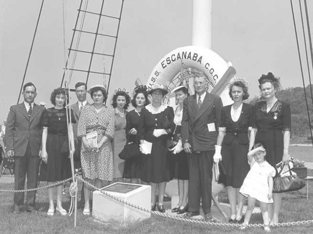 Next of kin, wives, and family of those lost on the Escanaba gather to dedicate her memorial. Image Source: USCG.mil/ public domain