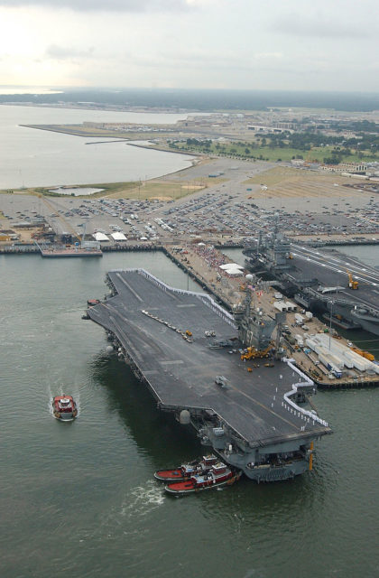 The Naval Station Norfolk in 2002 with the USS John F. Kennedy about to dock